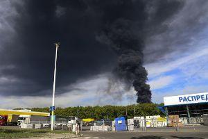 Smoke rises from the oil depot after missiles struck the facility in an area controlled by Russian-backed separatist forces in Makiivka, 15 km (94 miles) east of Donetsk, eastern Ukraine, Wednesday, May 4, 2022. 