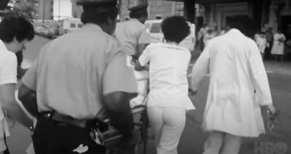 a stretcher being wheeled into an emergency room
