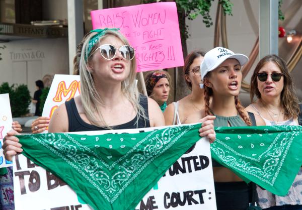 New York City July 9 RU4AR women flare green bandanas.
