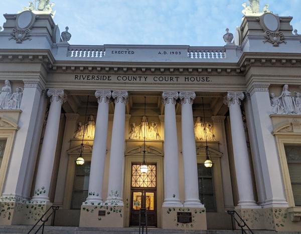 RU4AR put green handprints on Riverside Courthouse to protest overturn of Roe v Wade.