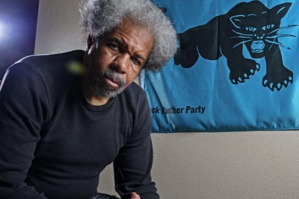 Albert Woodfox with Black Panther Party banner