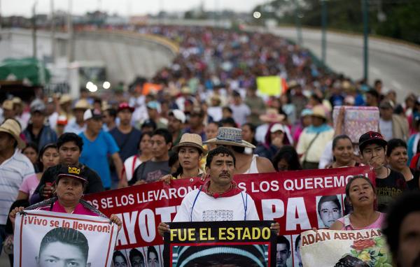 43 Ayotzinapa teachers' college students' relatives protest their disappearance one year later.