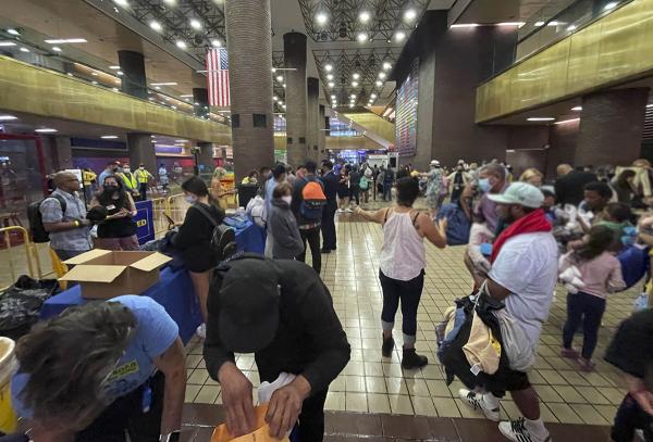 Immigrants arrive by bus at Port Authority, New York City, August 19, 2022.