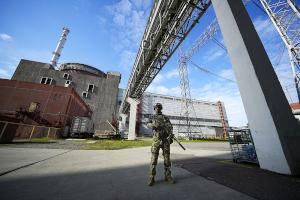 Russian soldier guards Zaporizhzhia nuclear power plant in Ukraine.