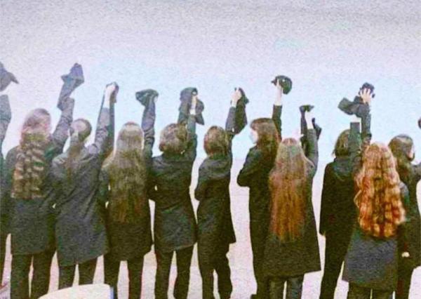 Iranian girls remove hijab in honor of murdered Mahsa Amini, September 2022.