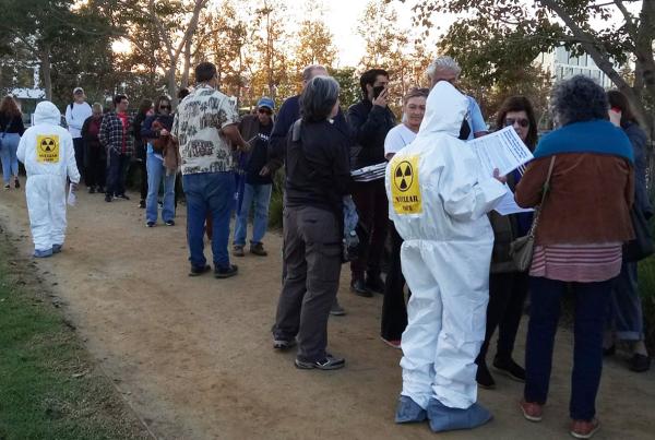 Los Angeles RevClub pass out fliers about BA interview at Bernie event.