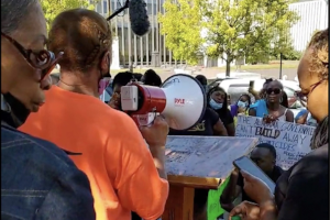 September 26, 2022: A woman whose brother was one of three inmates to die from medical neglect in the last two months at the Bibb “Correctional Facility” speaks at a "Break All the Chains" rally outside the Alabama State House in Montgomery.
