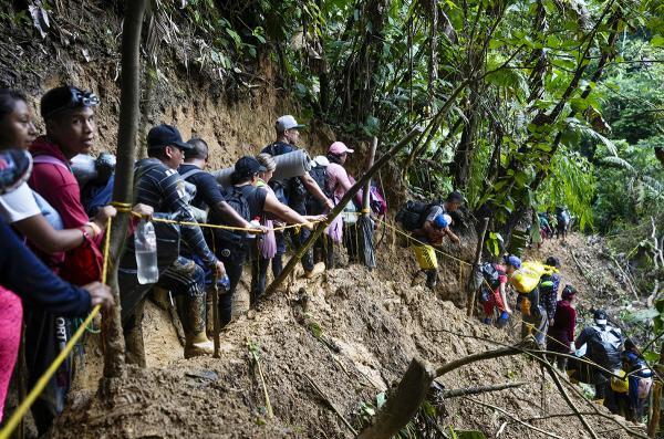 Venezuelan migrants walk across the treacherous Darién Gap from Colombia into Panama hoping to reach the U.S., October 15, 2022. 