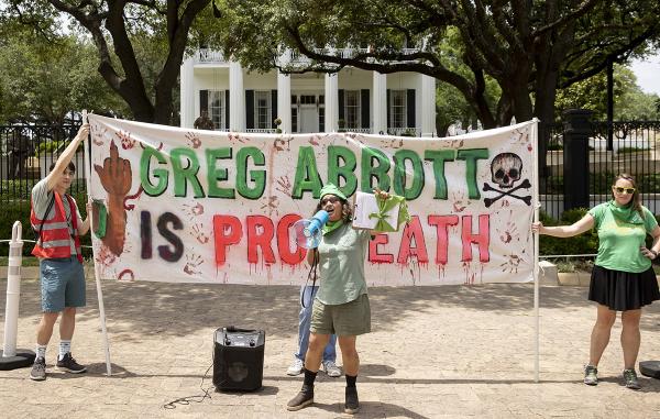 RU4AR in Austin, Texas with banner: "Greg Abbott is Pro Death."