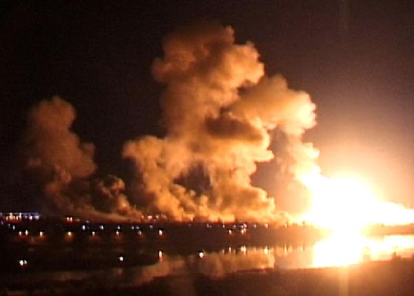 Flames light the skies from U.S. bombardment of Baghdad, Iraq, March 21, 2003.