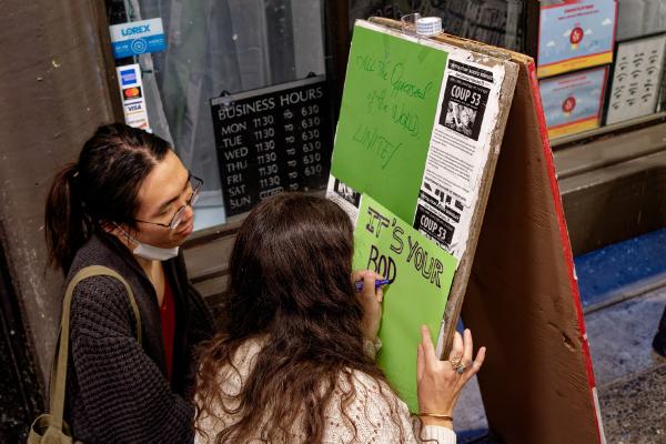 UC Berkeley, IWD 2023, students make signs for celebration.