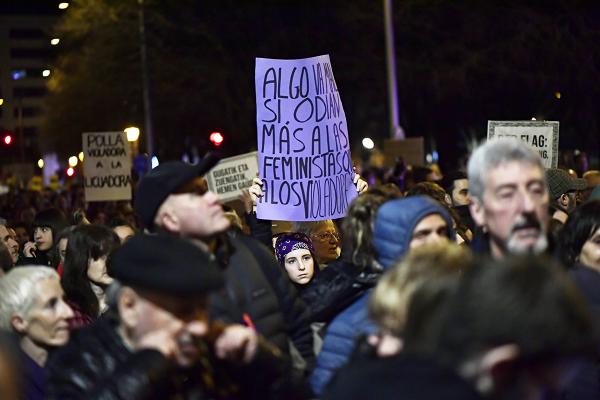 Pamplona, Spain, IWD 2023: Woman with sign, "Something is wrong if they hate feminists more than rapists."