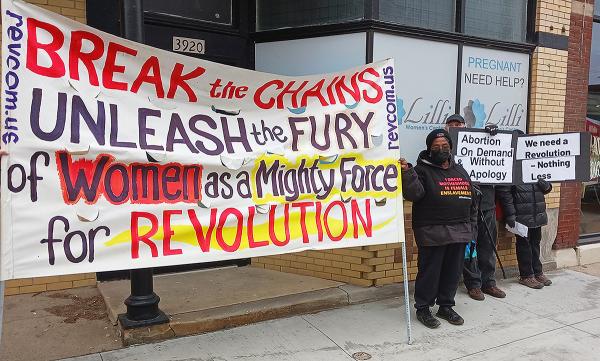 Cleveland, IWD 2023, Break the Chains banner in front of drugstore.