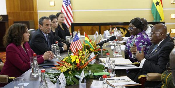 Kamala Harris at conference table with Ghanian politicians, March 2023.