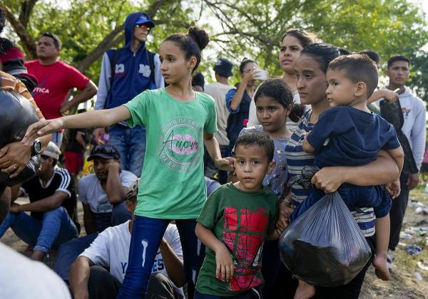 Migrant asylum seekers on the Mexican side of the Rio Grande river bank waiting to cross to the U.S. before Title 42 ends, May 10, 2023.