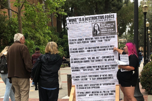 Revcoms on the UCLA campus building for Sunsara’s talk: “Woke” Lunacy Vs. Real Revolution.