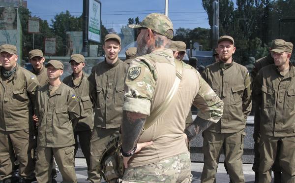Ukraine battalion officer's neck is tattooed with the symbol of the fascist Azov Batallion, July 2017.