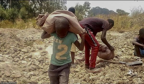 In Congo, children labor in cobalt mine.