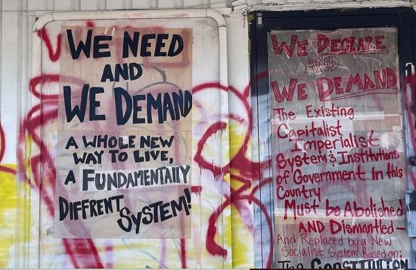 Austin, Texas, RevComs decorated wall with RevCom posters.