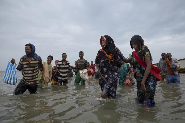Ethiopian migrants disembark onto shores of Yemen on their journey to Saudi Arabia, July 2019.