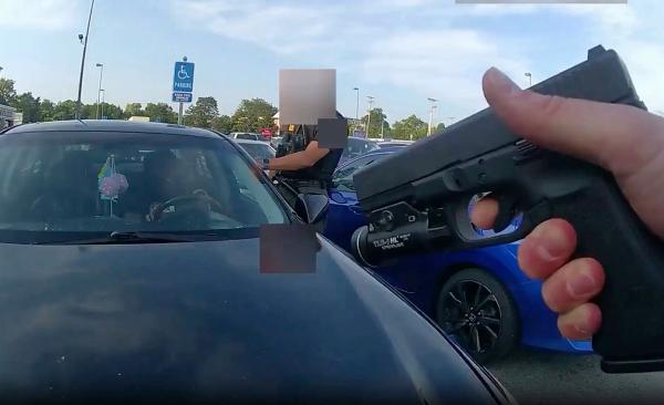 Ohio cops point guns at Ta'Kiya Young in her car, August 24, 2023.