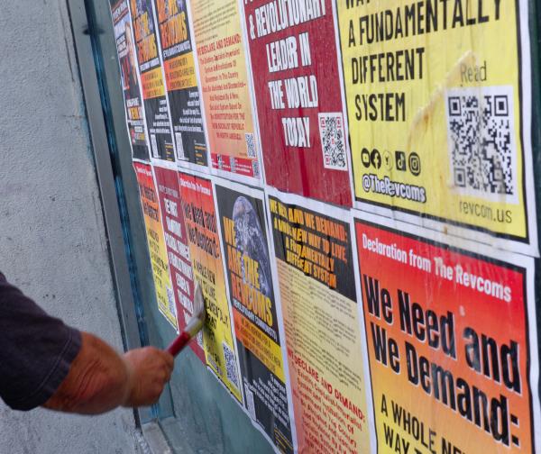 Postering a wall in Berkeley