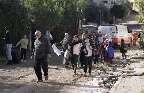 Palestinians flee Jenin refugee camp, November 29, 2023.
