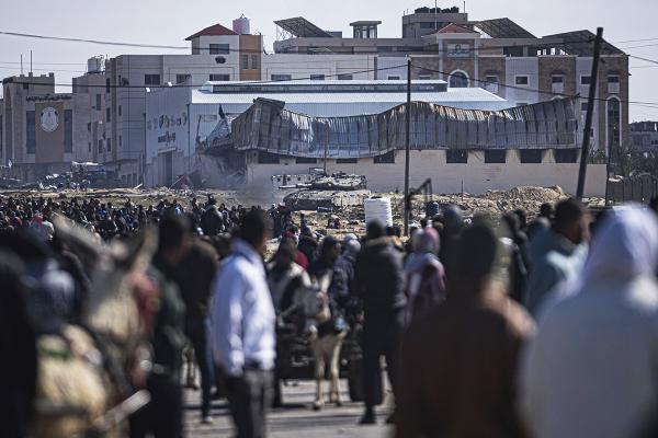 Palestinians fleeing from ground fire in Khan Younis are met with Israeli tanks in Rafah, January 26, 2024.