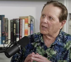 Headshot of Bob Avakian being interviewed