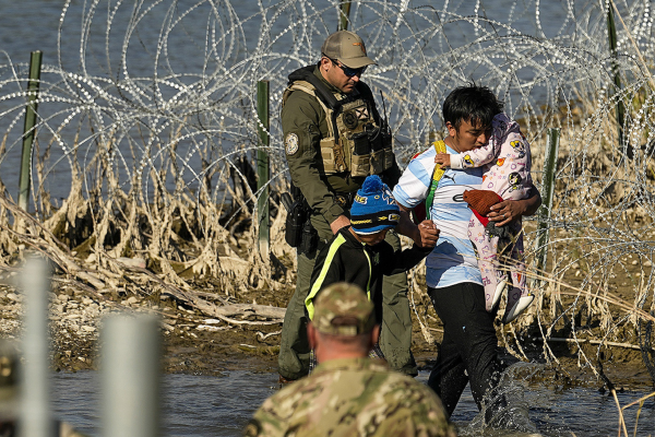 Migrants crossing the border at Eagle Pass, Texas are taken into custody by the officials, January 3, 2024.
