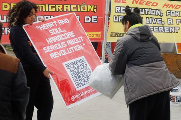 RevComs at San Ysidro, California, with @BobAvakianOfficial poster.