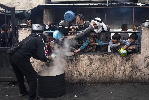 Rafah, Gaza, people line up for food, February 16, 2024.