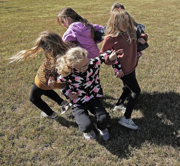 Children ring around in a circle.