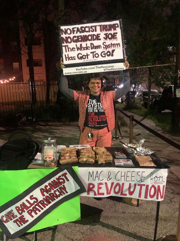 Vic with sign as the revcoms raised almost $200 at Univ of Texas at an unofficial SXSW event.