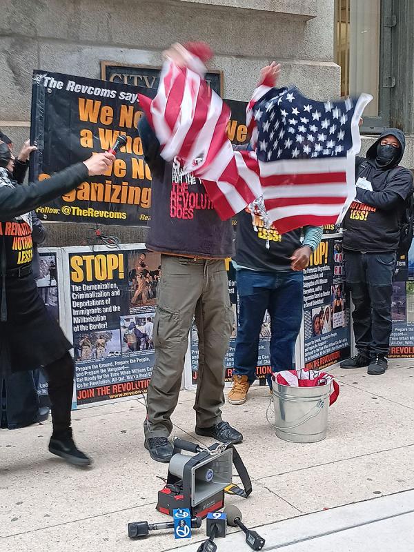 Vietnam vet rips up a flag before the April 1, 2024 Chicago City Council meeting.