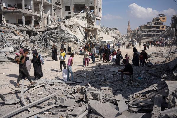 Palestinians search rubble after Israeli air and ground offensive in Khan Younis, April 8, 2024.