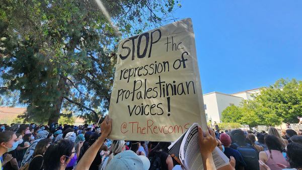 Students walk out at Pomona College, April 11, 2024.