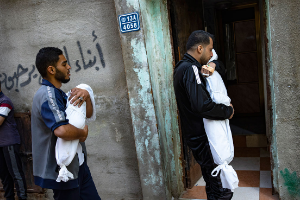 Members of the Abu Draz family hold the bodies of their relatives killed in the Israeli bombardment of the Gaza Strip, at their house in Rafah, southern Gaza, Thursday, April 4, 2024.
