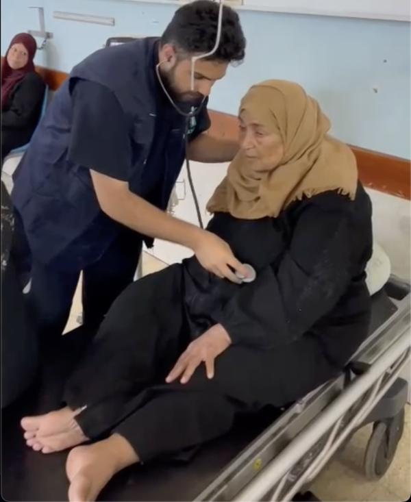 Dr. Majed Jabar with elderly patient