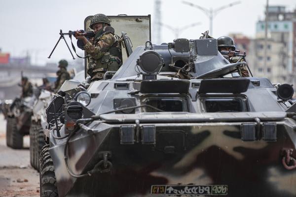 Bangladeshi military in armored tanks patrol the streets of Dhaka, Bangladesh after student protests, July 20, 2024.