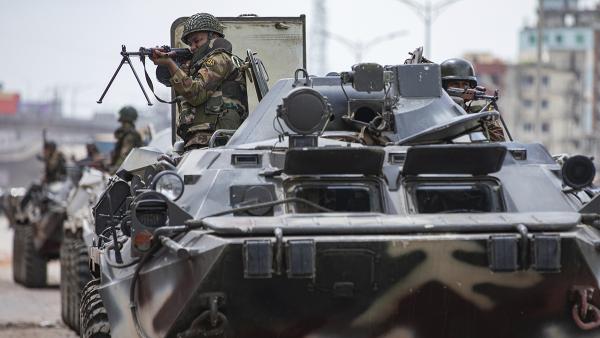 Bangladeshi military in armored tanks patrol the streets of Dhaka, Bangladesh after student protests, July 20, 2024.