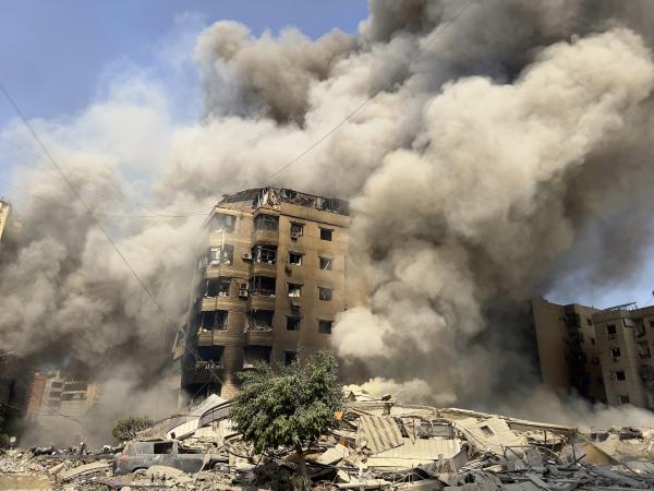 Lebanon: Smoke billows as a building collapses in Beirut's southern suburbs, September 28, 2024.