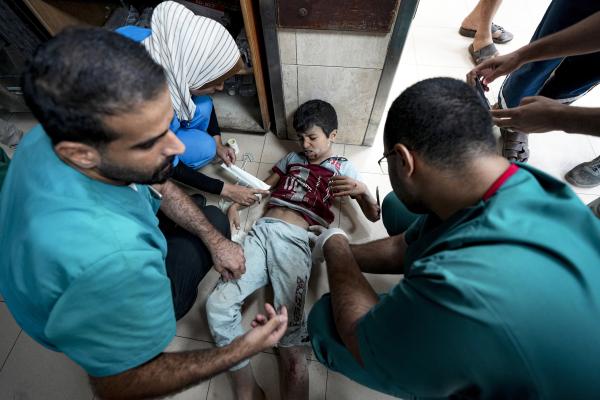 Doctors at Deir-el-Balah treat a child wounded in the Israeli bombardment of the Gaza Strip, September 29, 2024.
