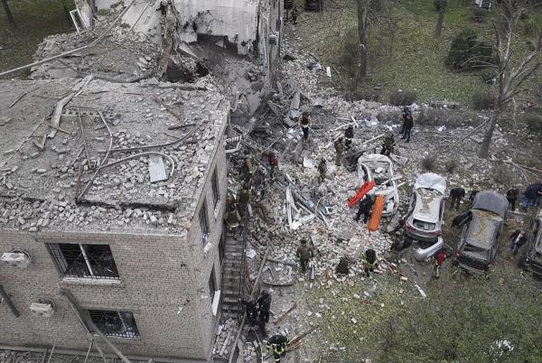 Ukraine: Workers clear the rubble after an overnight Russian attack with guided bombs in Zaporizhzhia, Ukraine, October 21, 2024.