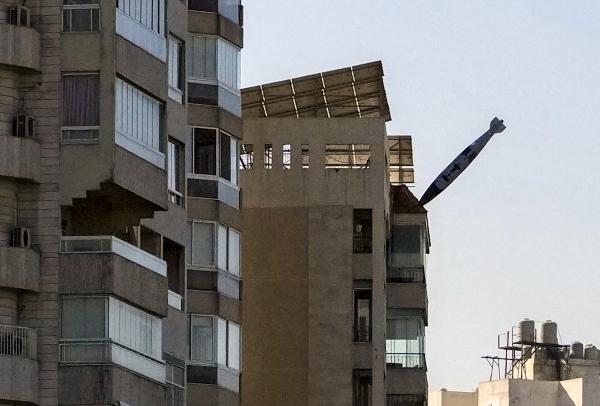 A bomb from an Israeli jet about to hit a building in Tayouneh, Beirut, November 15, 2024.