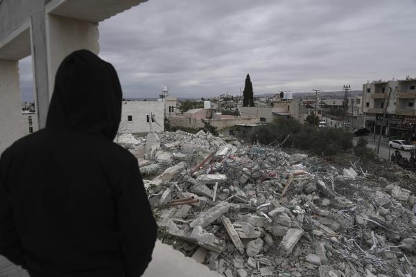 November 27, 2024: Palestinian looks at destruction of homes from September Israeli airstrike on city of Hebron.