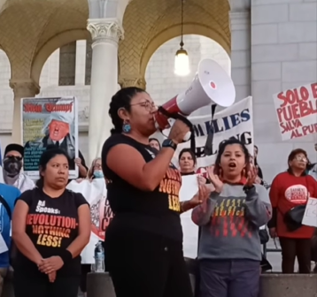 Revcom Corps speaks at Interational Migrants Day Rally in Los Angeles, Dec 18 2024.
