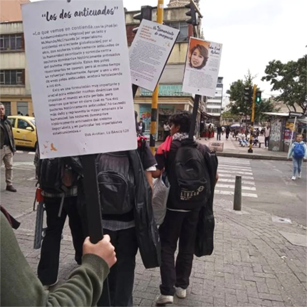 Among the posters carried by marchers in Bogotá was this enlarged quote from Bob Avakian on the “Two Outmodeds”. 