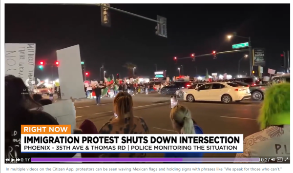 Screenshot of pro-immigrant protest blocking a busy intersection in Phoenix, Arizona.