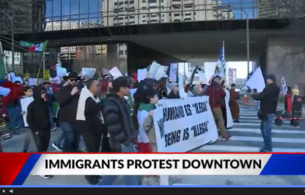 Pro-immigrant march in St. Louis February 1. Banner says No Human Is Illegal.